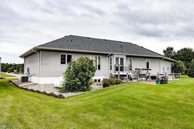 back of house featuring a patio and a yard