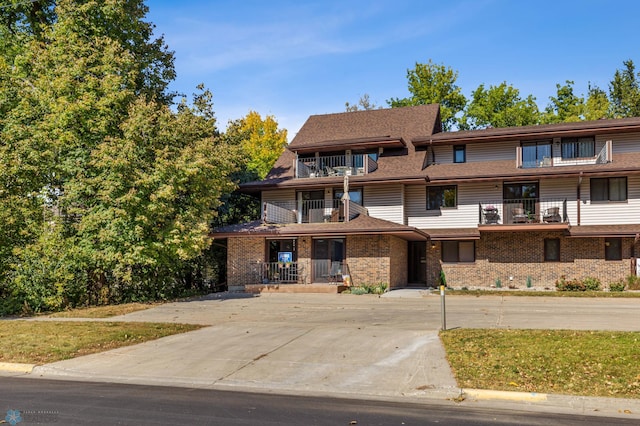 view of front of property with a balcony