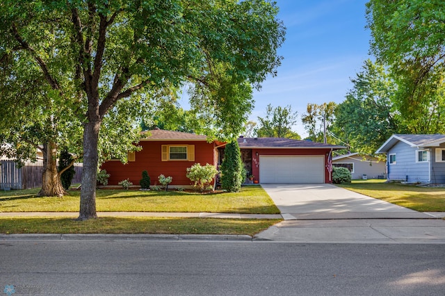 single story home with a garage and a front yard