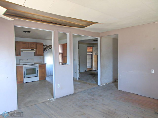 kitchen with light wood-type flooring and white range with electric stovetop