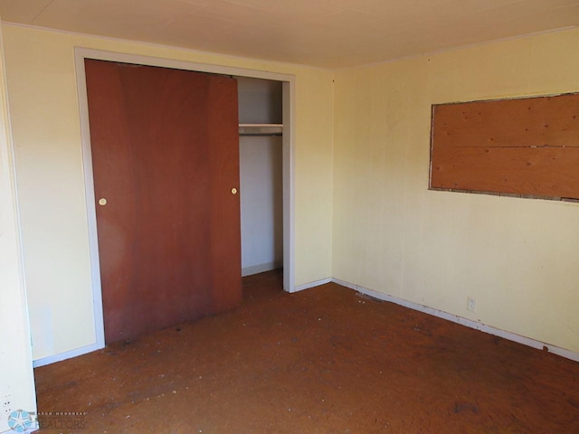 unfurnished bedroom with a closet