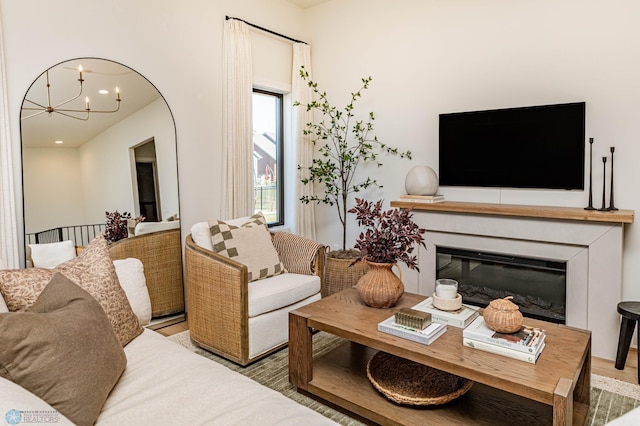 living room featuring a chandelier and hardwood / wood-style floors