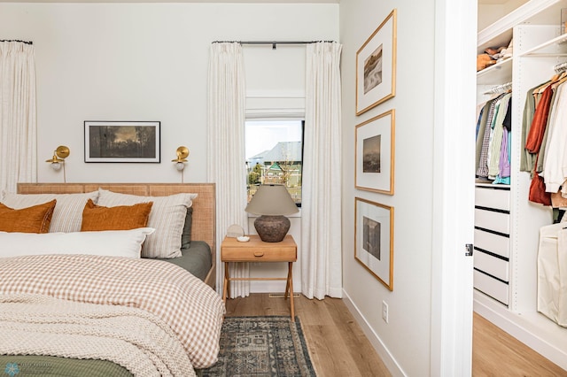 bedroom featuring a closet and light hardwood / wood-style floors