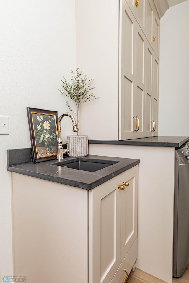 interior space with sink and washer / dryer