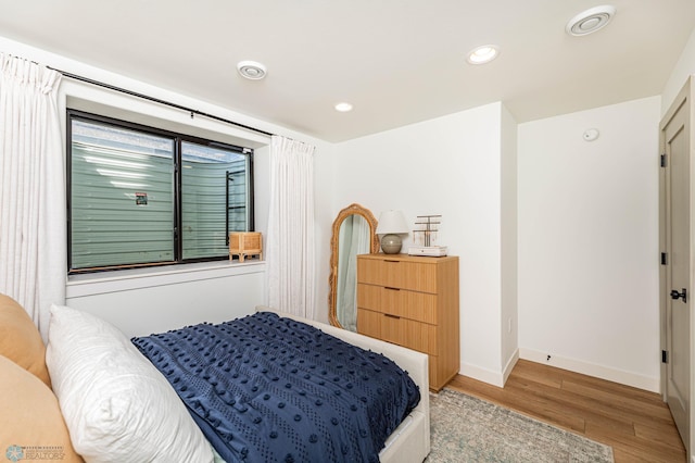 bedroom with light hardwood / wood-style floors