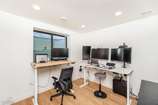 office space with hardwood / wood-style flooring