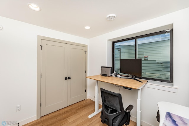 office with light wood-type flooring