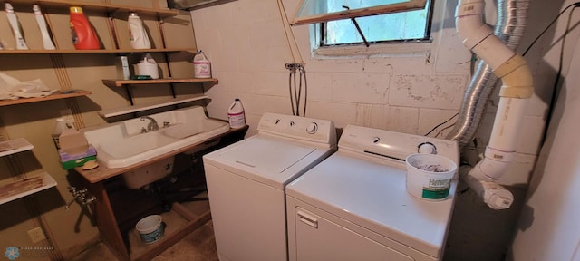 washroom featuring washer and clothes dryer