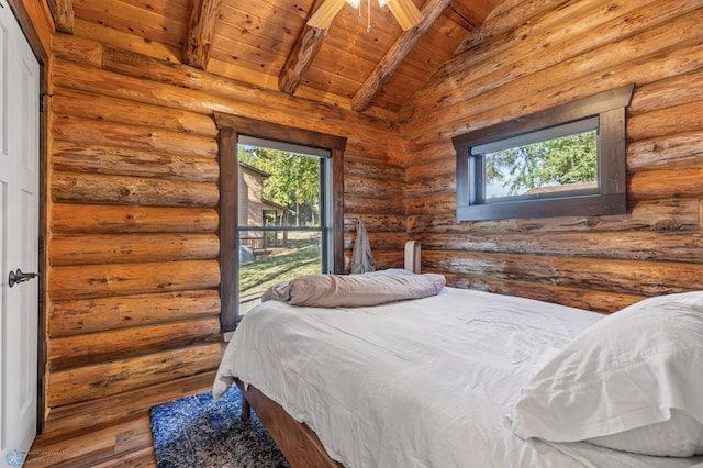 bedroom with vaulted ceiling with beams, wood ceiling, log walls, and hardwood / wood-style flooring