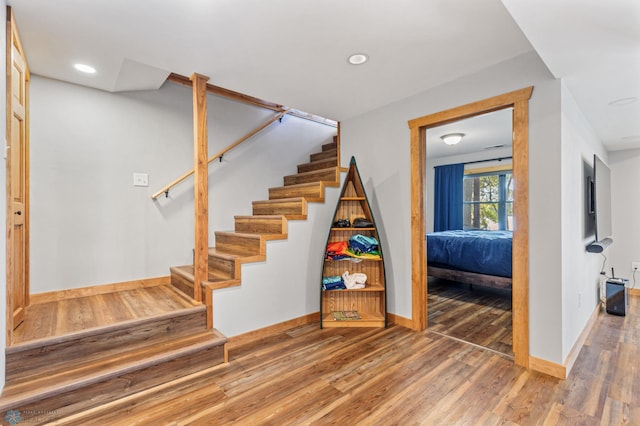 stairs with wood-type flooring