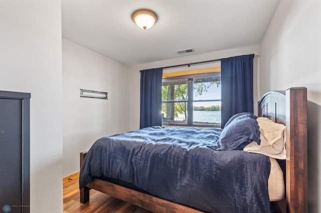 bedroom featuring wood-type flooring