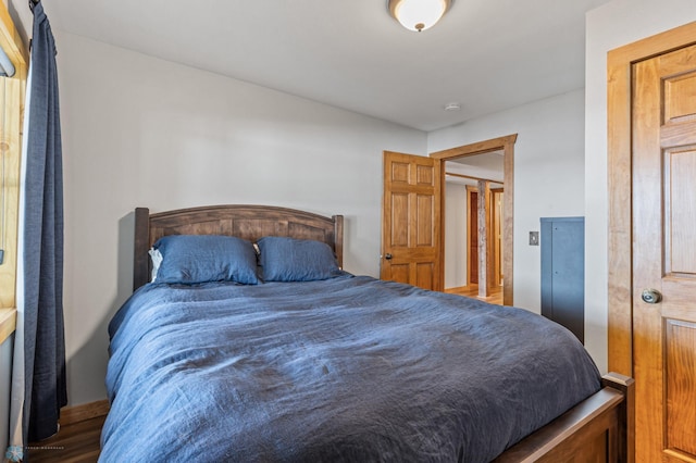 bedroom with hardwood / wood-style floors