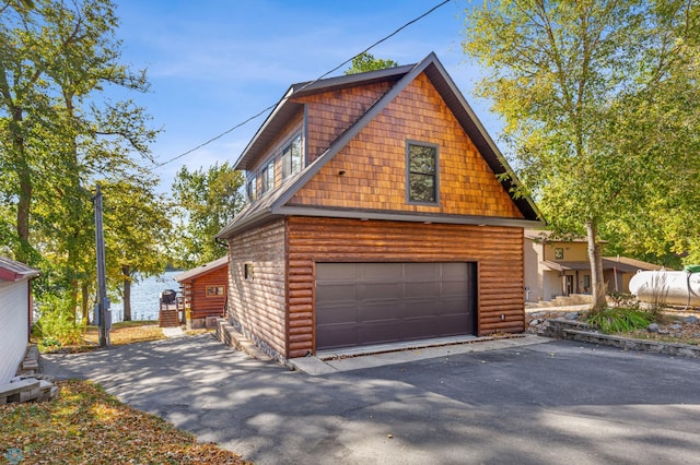 view of side of home featuring a garage