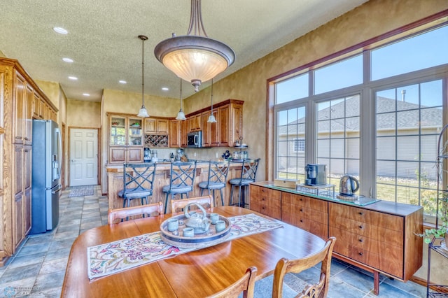 dining room featuring a textured ceiling