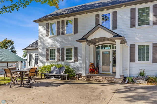 property entrance with a patio area