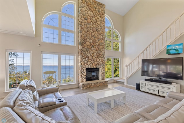 living room featuring a fireplace and plenty of natural light