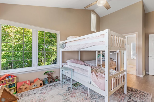 bedroom featuring lofted ceiling, hardwood / wood-style flooring, and ceiling fan