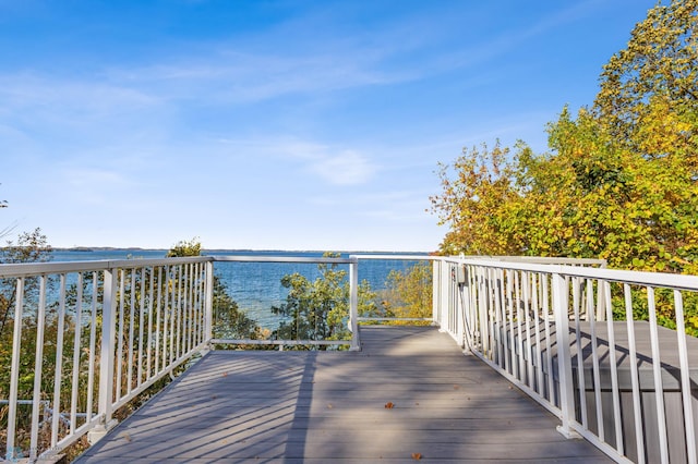 wooden deck with a water view