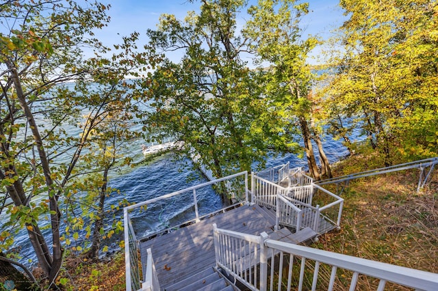 wooden deck featuring a water view