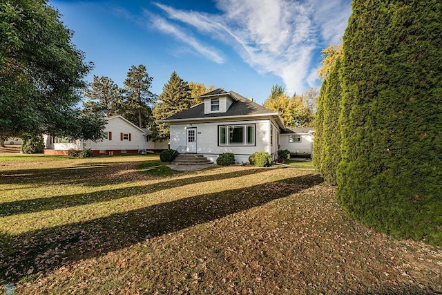 view of front of home with a front yard