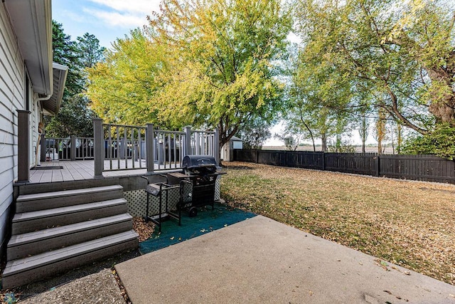 view of yard with a deck and a patio area