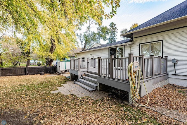 rear view of property with a wooden deck