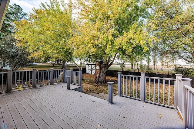 wooden deck featuring a shed