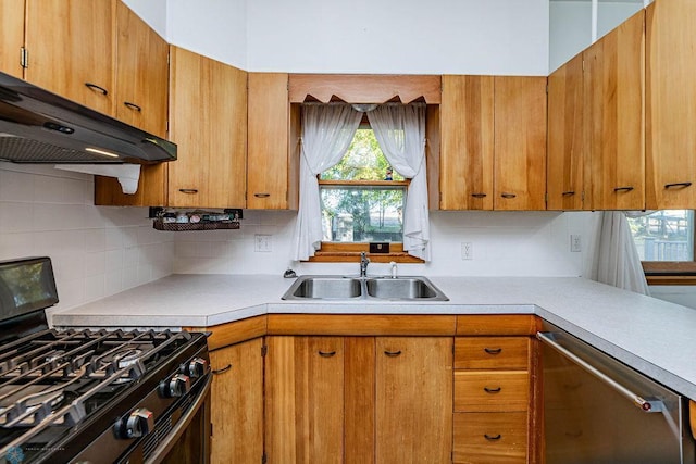 kitchen featuring sink, stainless steel dishwasher, backsplash, ventilation hood, and black range with gas stovetop