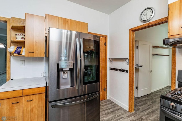 kitchen with decorative backsplash, dark hardwood / wood-style floors, and stainless steel appliances