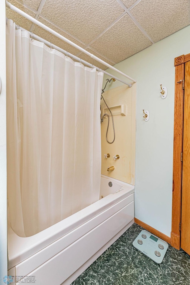 bathroom featuring shower / bath combination with curtain