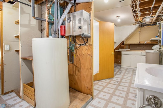 utility room with gas water heater and sink