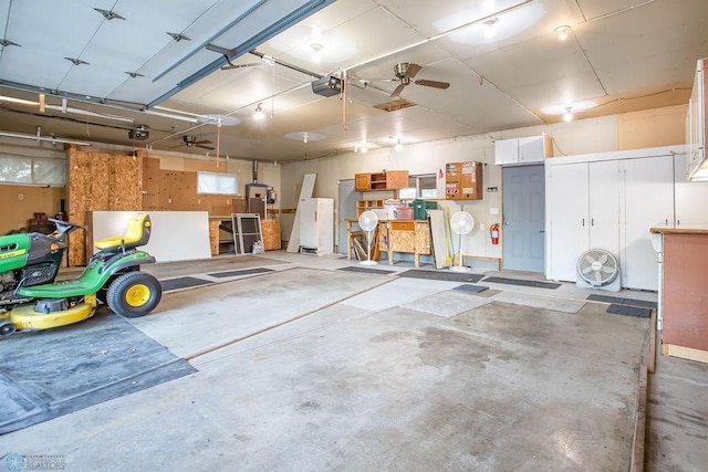 garage featuring ceiling fan and a garage door opener