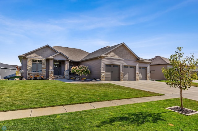 craftsman-style house featuring a front yard and a garage