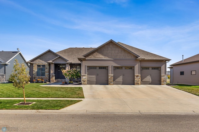 craftsman house with a front lawn and a garage