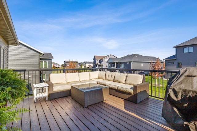 wooden deck with an outdoor living space