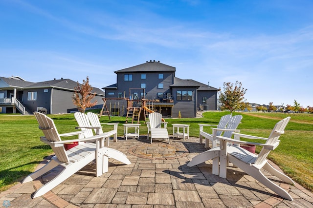 view of patio with a fire pit and a wooden deck