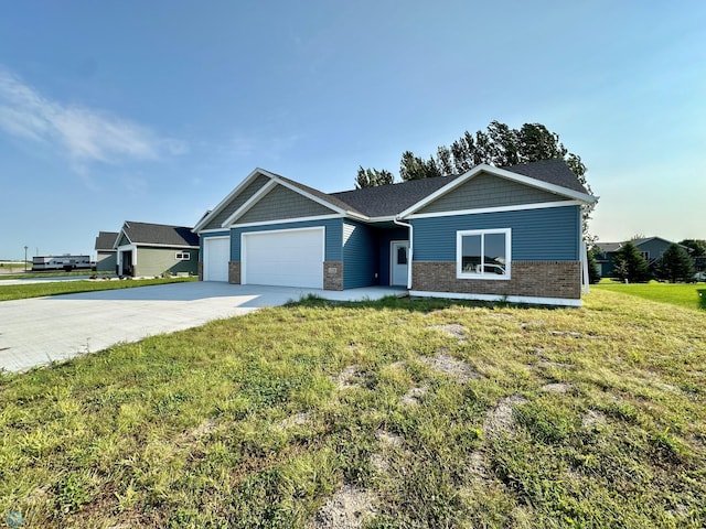 single story home with a front yard and a garage