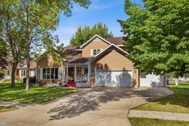 view of front of home with a garage and a front lawn