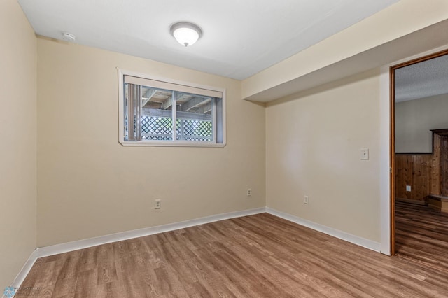 unfurnished room with light hardwood / wood-style floors