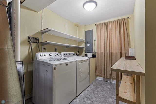 clothes washing area with independent washer and dryer and electric panel