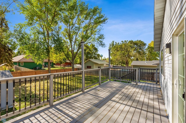 wooden terrace with a yard