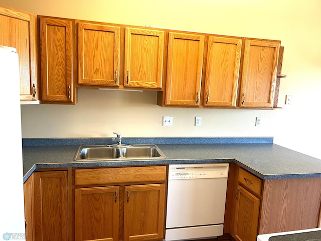 kitchen with white appliances and sink