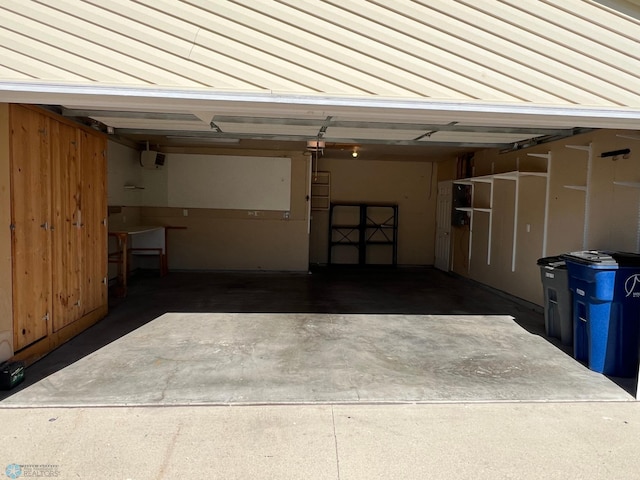 garage featuring wooden walls