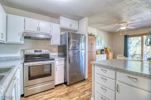 kitchen featuring ceiling fan, white cabinetry, light hardwood / wood-style flooring, appliances with stainless steel finishes, and a textured ceiling