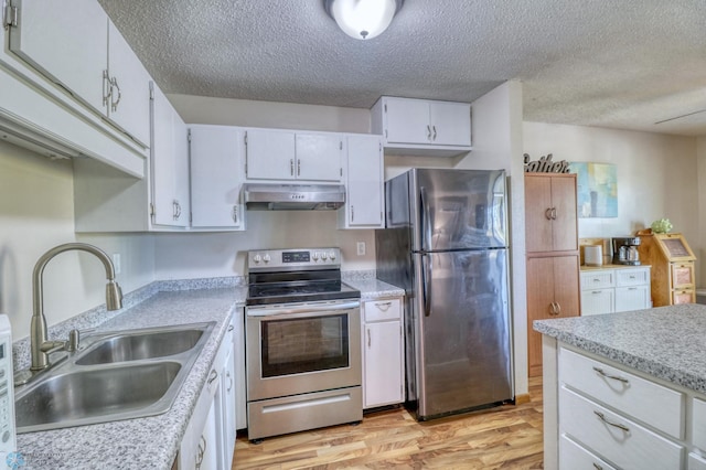 kitchen featuring light hardwood / wood-style floors, sink, stainless steel appliances, and white cabinets