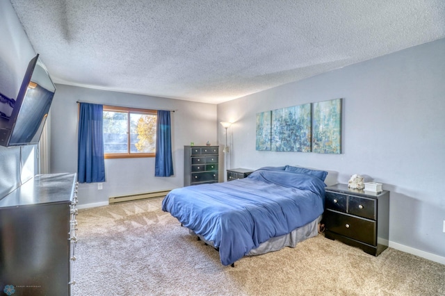 bedroom featuring light carpet, a baseboard radiator, and a textured ceiling