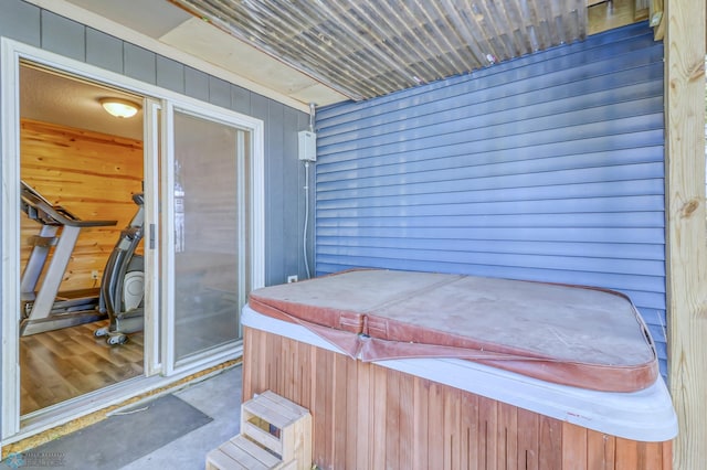 view of patio / terrace with a hot tub