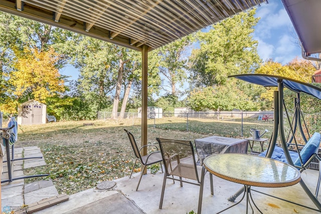 view of patio featuring a storage shed