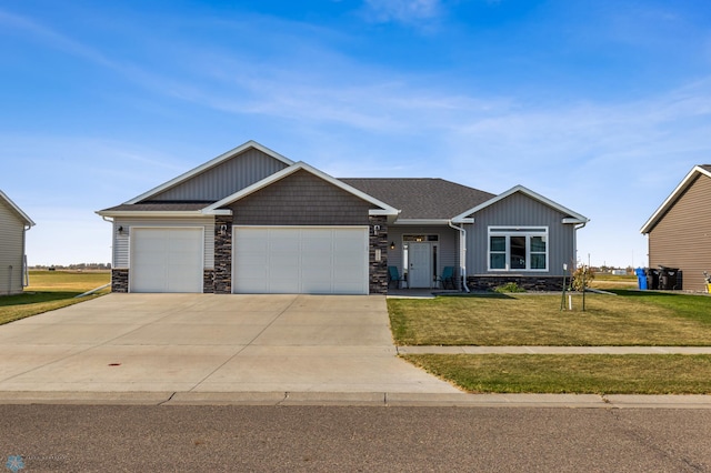 craftsman-style house with a front yard and a garage