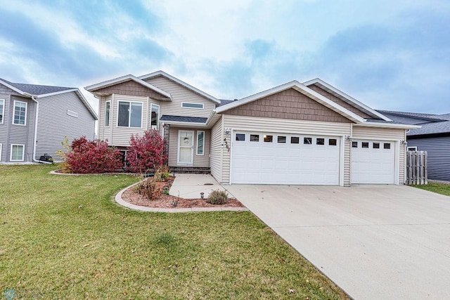 view of front of home featuring a front yard and a garage